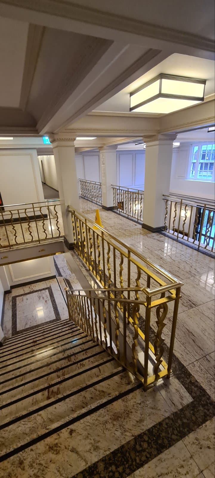 Restored granite staircase in London with high-gloss, mirror-like finish – professional polishing result by our specialist team.