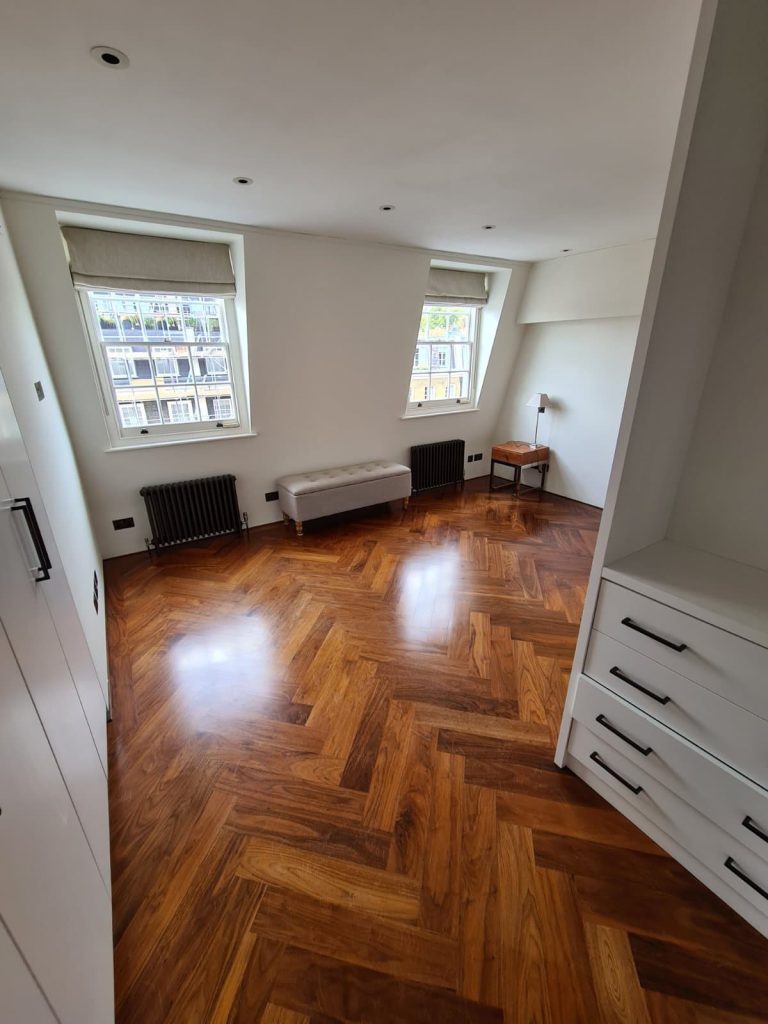 sanded parquet in Belgravia our pStunning restored herringbone parquet floor in a Canonbury Georgian townhouse, showcasing warm oak tones after professional sanding and oil finisharquet sanding in Belgravia