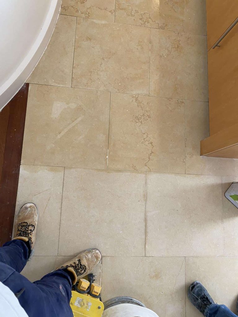 Before and after marble floor polishing comparison showing dull worn marble transformed to high gloss mirror finish