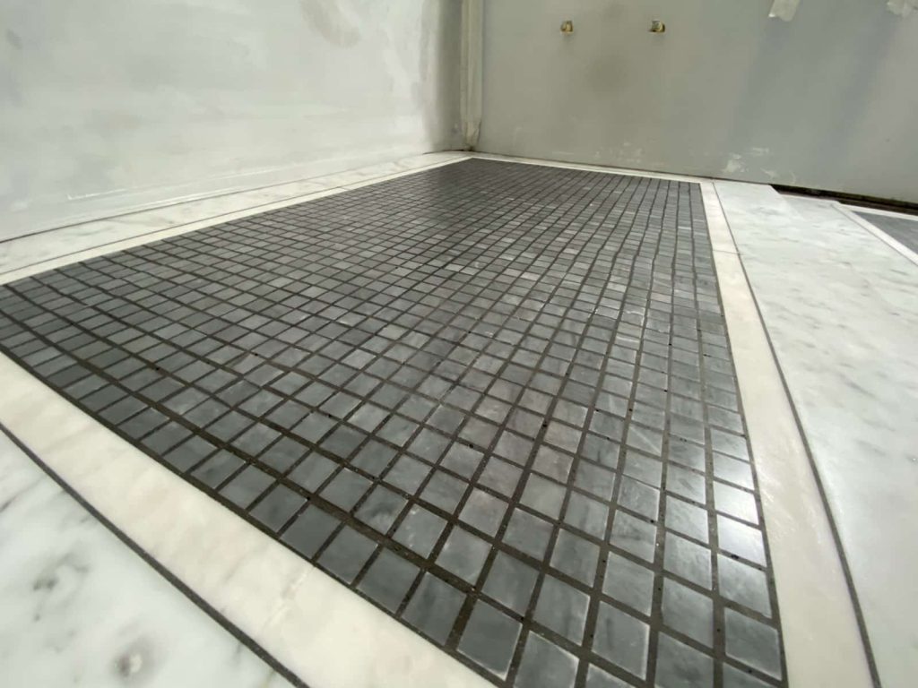 Comparison of polished, honed, tumbled, and brushed marble floor finishes showing different surface textures