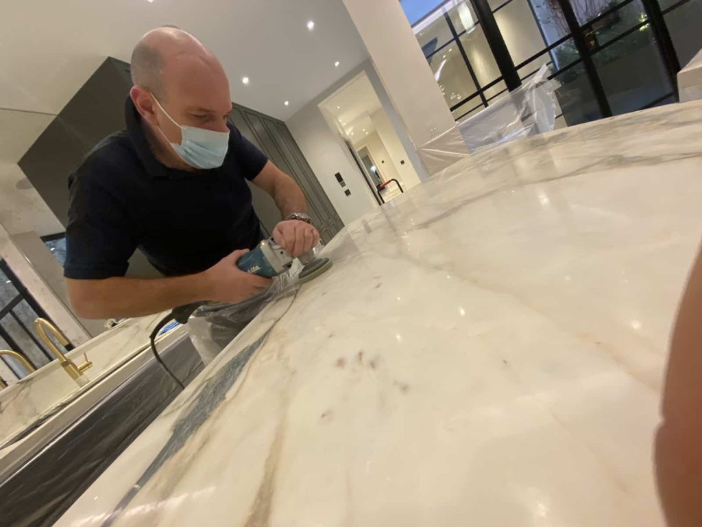 Before and after photos showing etch marks from lemon juice on marble worktop completely removed through professional polishing