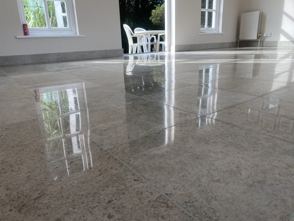 Restored and polished limestone floor in London – professional stone restoration showing enhanced colour and high-gloss finish.