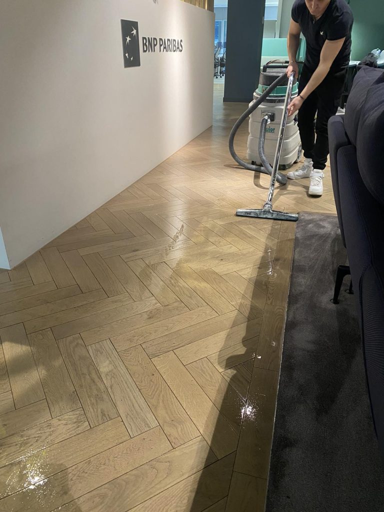 Professional office floor cleaning in progress at BNP Paribas Bank, London EC2V – specialist team restoring commercial flooring in The City.