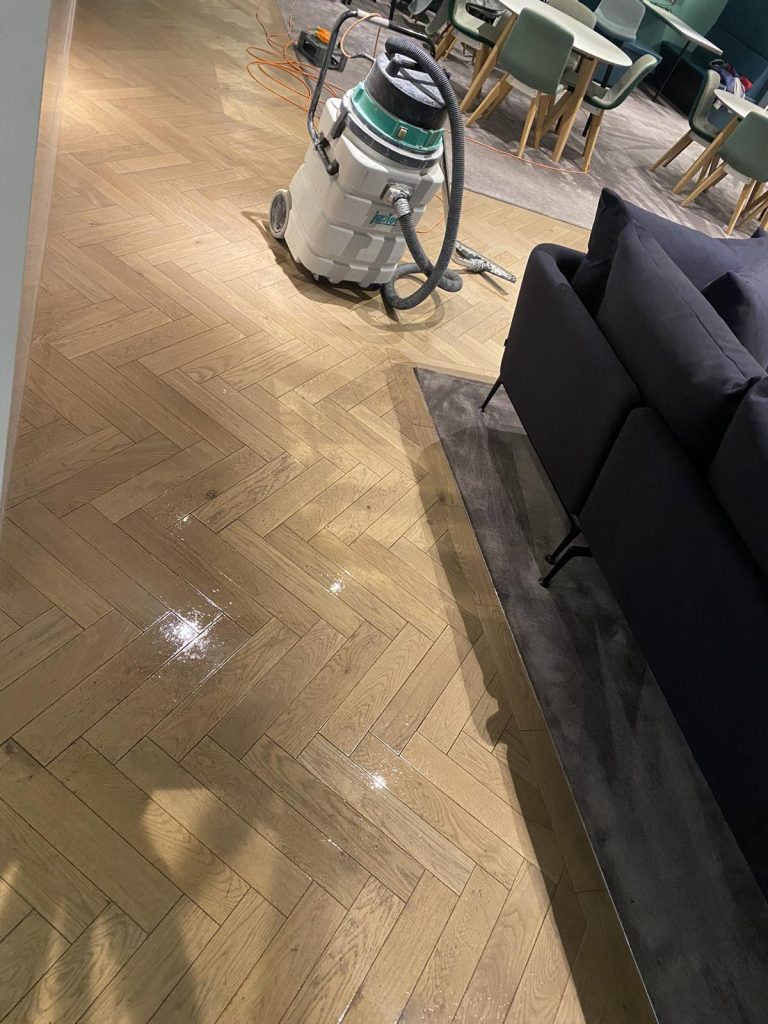 Mechanical floor rejuvenation in progress at London office space – specialist team using advanced equipment for commercial floor restoration.